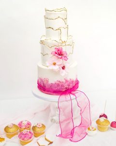 pink gold wedding cake cosmos sugar flowers gold textured painted table display cupcakes biscuits wafer paper