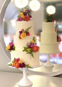 3 tier buttercream wedding cake fresh flowers romantic classic elegant textured colourful summer