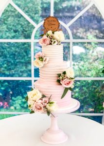 3 tier buttercream wedding cake fresh flowers romantic classic elegant pink ombre