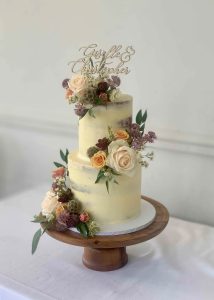 2 tier buttercream wedding cake fresh flowers romantic classic elegant semi naked