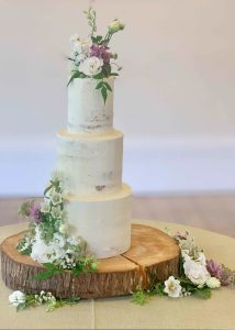 3 tier buttercream wedding cake fresh flowers romantic classic elegant semi naked rustic garden natural