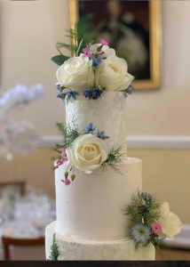 detail 5 Tier Buttercream Wedding Cake Fresh Flowers white green stencil