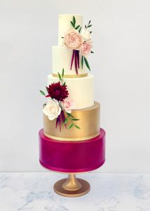 5 tier iced wedding cake sugar flowers roses textured romantic tall classic elegant stylish claret magenta gold