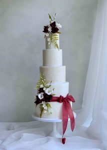 5 tier iced wedding cake sugar flowers roses textured romantic tall classic elegant
